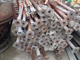 a large pile of pipes and pipes in a warehouse