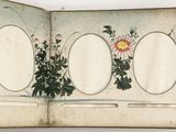 un livre ouvert sur lequel figure une illustration de fleurs et de feuilles