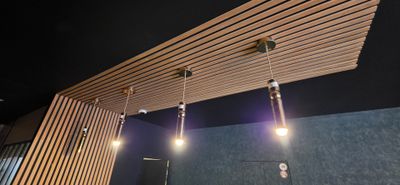 three lights that are hanging from the ceiling in the room