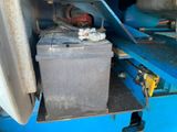 an image of a machine that is working on a piece of metal