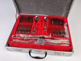 silverware in a silver case on a white surface