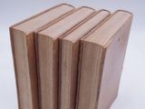 four books stacked on top of each other on a white surface