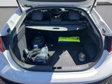 a trunk of a car with a lot of items in it