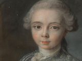 portrait of a young boy in a blue dress and a white hat