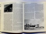 an open book with a picture of a plane on it