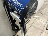 a blue and black blow dryer sitting on top of a stand