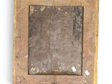 a picture of an old wooden frame with a ring on it