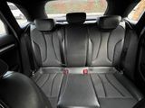 the back seats of a car are black and grey in color
