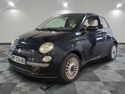 a picture of a small black car parked in a garage