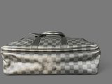 an image of a silver and black checkered suitcase