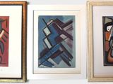 three framed paintings of different shapes and sizes on a white wall
