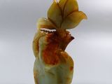 a picture of a vase with a leaf on it