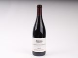 a bottle of wine that is sitting on a table