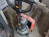 a small machine that is sitting in a garage