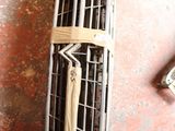 a metal grill on the floor next to a pair of shoes