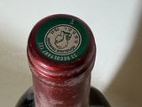 a bottle of wine that is sitting on a table