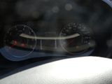 a close up of a car dashboard with a speedometer and gauges