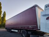 a semi truck that is parked on the side of the road