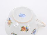 a white bowl with a floral design on it