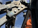 a close up of a cell phone attached to a crane