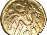 a close up of a gold coin with a dragon on it