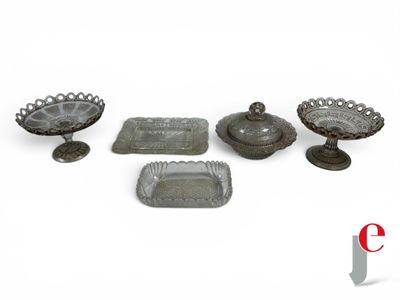 a group of glass dishes and trays sitting on a table