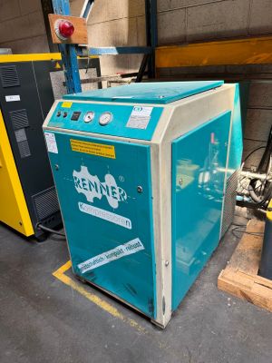 a blue machine that is sitting in a warehouse