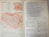 an open book with a map of a city on it