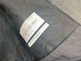a close up of a black jacket with a label on it