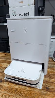 a white printer sitting on top of a wooden floor