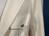 a close up of a white suit on a mannequin mannequin