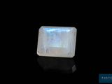 a white quartz stone on a black surface