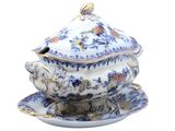 a picture of a blue and white tureeny with a bird on it