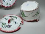 a cup and saucer sitting next to each other on a table