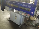 a picture of a machine that is working on a piece of wood
