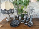 a table that has a lot of silver items on it
