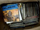 a cardboard box filled with a lot of vinyl records