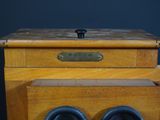 a wooden box with a pair of binoculars on it
