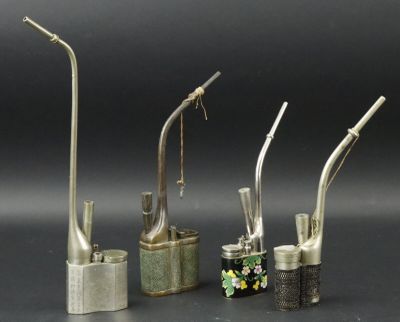 three different types of toothbrushes and a toothbrush holder on a table