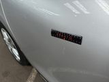 a close up of a car with a sticker on it