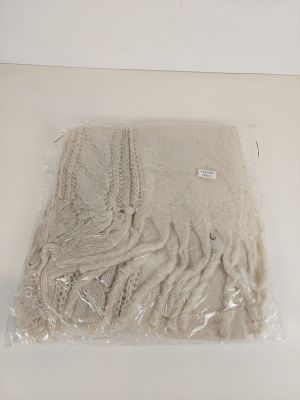 a blanket that is wrapped in plastic on a table