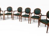 set of six chairs with green upholstered leather seats