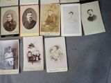 a lot of old photos of people on the table