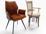 two chairs and a chair that are sitting next to each other
