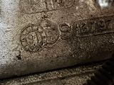 a close up of a piece of metal with writing on it