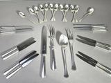 many spoons, forks, knives and spoons arranged in a circle