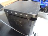 a black computer sitting on top of a glass table