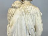 marble statue of a man holding a child in his arms