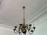 a chandelier hanging from the ceiling in a room