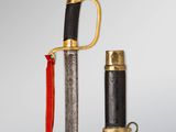 an image of a sword with a red handle and a black handle